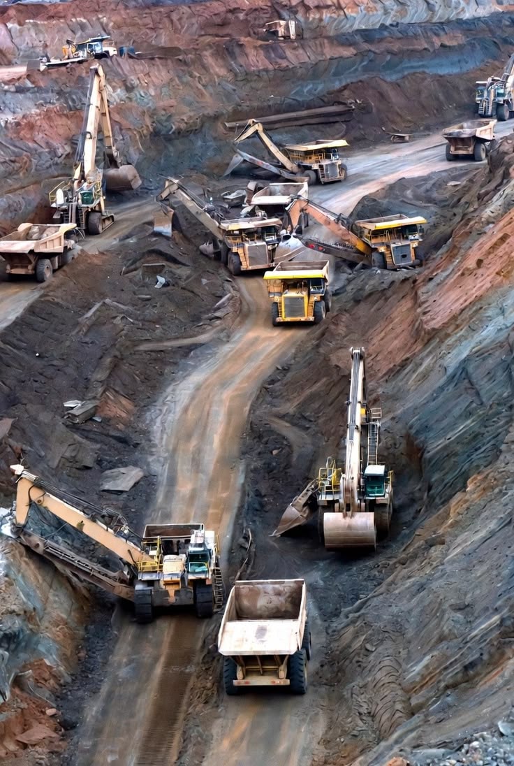Heavy duty mining excavation equipment on site during golden hour